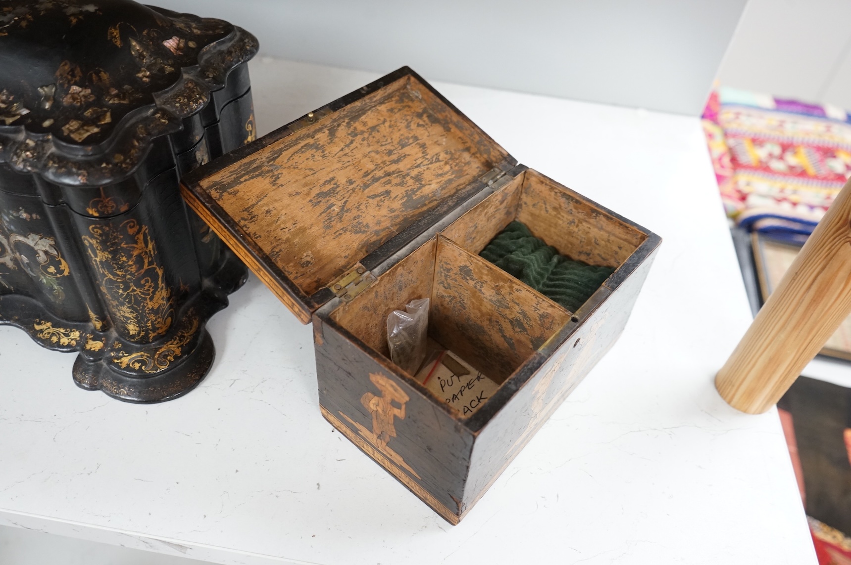 A large Victorian Papier maché and mother-of-pearl tea caddy, 32cm wide, and a Sorrento ware marquetry tea caddy, 19.5cm wide.